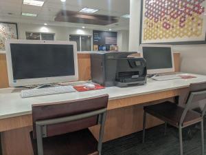 an office with a desk with a computer and a printer at Holiday Inn Express Fort Wayne - East - New Haven, an IHG Hotel in New Haven