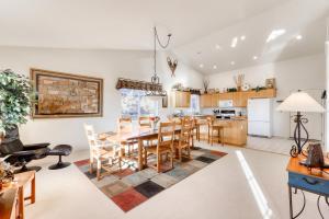 a kitchen and dining room with a table and chairs at Eagle Crest Nature Retreat in Redmond