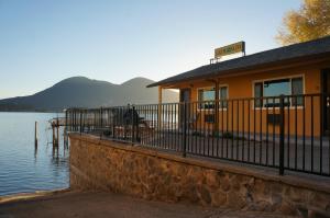 a building on the side of a body of water at Lake Marina Inn in Clearlake Oaks