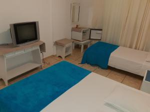 Μια τηλεόραση ή/και κέντρο ψυχαγωγίας στο Apart-Hotel Flat Cavalinho Branco
