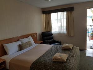 Postel nebo postele na pokoji v ubytování Peppercorn Motel