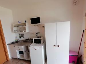 Kuchyňa alebo kuchynka v ubytovaní Penzion Nad jezerem