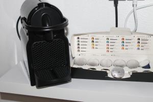 a black and white appliance sitting on a shelf at Casa dos Tios Estremoz-veiros in Veiros