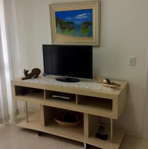 Et tv og/eller underholdning på EXCELENTE APTO C/VISTA AO MAR