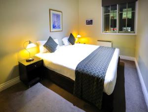 a bedroom with a large bed and a window at Flinders Landing Apartments in Melbourne