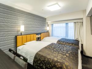 En eller flere senger på et rom på APA Hotel Kyoto Ekihigashi
