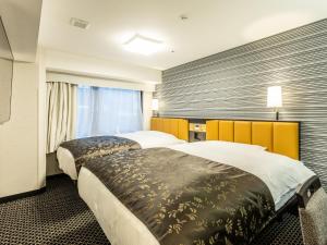En eller flere senger på et rom på APA Hotel Kyoto Ekihigashi
