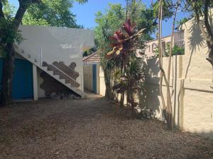 a house with a staircase on the side of it at Apartamento beira da Praia das Ondinas in São Lourenço do Sul
