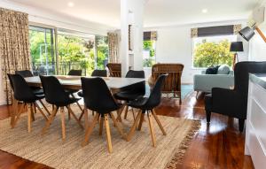 a dining room with a table and chairs at The House at No 1 in Havelock North