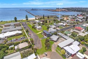 an aerial view of a small town next to the water at Admella Motel in Portland