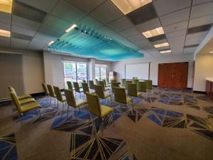 a conference room with chairs and a whiteboard in a building at Holiday Inn Express Hotel & Suites Miami - Hialeah by IHG in Hialeah