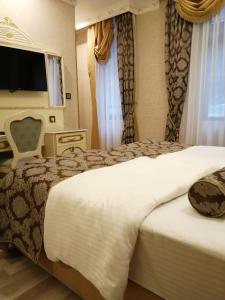 Postel nebo postele na pokoji v ubytování Nayla Palace Hotel-Special Category