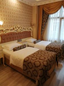 Postel nebo postele na pokoji v ubytování Nayla Palace Hotel-Special Category