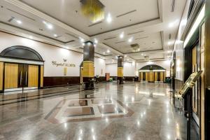 a large hall with a lobby with doors and a building at Crystal Crown Hotel Harbour View, Port Klang in Klang
