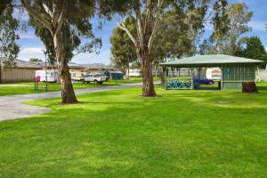 a park with trees and a grassy area at Carrum Downs Motel in Carrum Downs