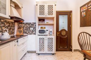 A kitchen or kitchenette at USSR Apartment