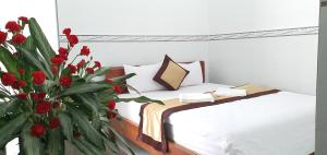 Giường trong phòng chung tại Tai Tri Guest House