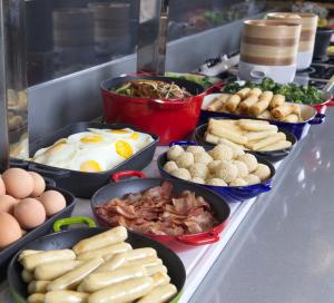 a buffet with eggs and other food on a table at Campanile Shanghai Huaihai in Shanghai