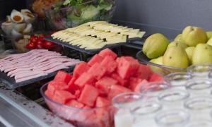 a buffet of food with fruit and meats and cheese at Campanile Shanghai Huaihai in Shanghai