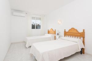 Ένα ή περισσότερα κρεβάτια σε δωμάτιο στο Ca na Rosa (Es Portitxol)