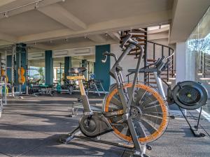 a bike is parked in a gym at Selong Selo Resort and Residences in Selong Belanak