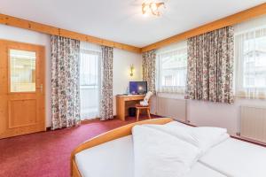 Katil atau katil-katil dalam bilik di Hotel Riedl im Zillertal
