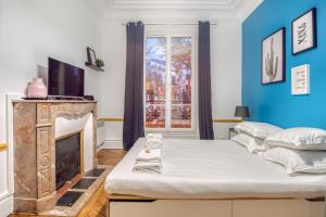 Lova arba lovos apgyvendinimo įstaigoje Basilique du Sacré Coeur - Beautiful 4P apartment