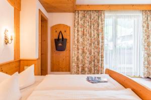Katil atau katil-katil dalam bilik di Hotel Riedl im Zillertal