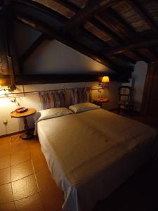 Säng eller sängar i ett rum på Residence In Centro