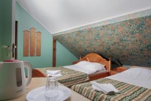 Säng eller sängar i ett rum på Riga Well Hotel