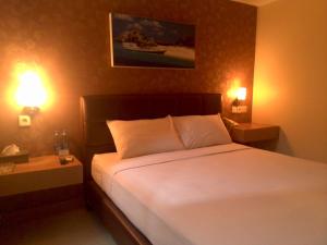 Giường trong phòng chung tại Antoni Hotel
