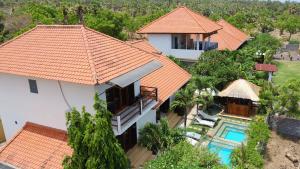 an aerial view of a house with an orange roof at Ocean Villa Dive Resort - Tulamben in Tulamben