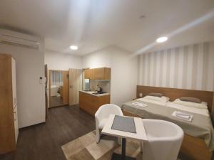 Posteľ alebo postele v izbe v ubytovaní Apartments 461