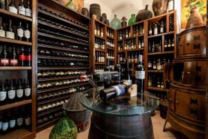 a wine tasting room with a machine on a table at Hotel Villa Sonia in Taormina