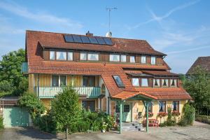 a house with solar panels on its roof at Ferienwohnungen Fontana in Bad Gögging