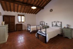 Giường trong phòng chung tại Borgo Palazzuolo Vecchio