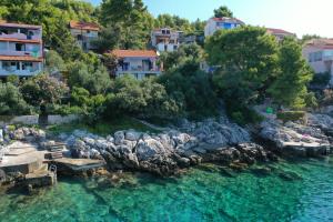 an island in the water with houses and condos at Holiday Home Prizba in Prizba