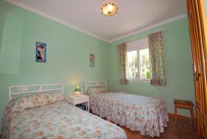 Postel nebo postele na pokoji v ubytování Villa Bugamvilla - Deniasol + 23 fotografií
