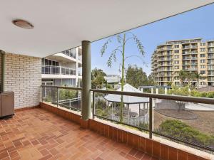 a balcony with a view of a building at Mariners Apartment 21 in The Entrance