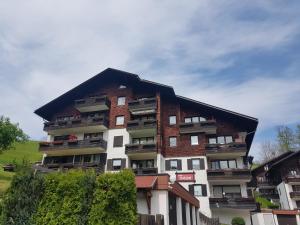 a large building with balconies on the side of it at Haus Hochgrat in Oberstaufen