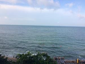 a group of people swimming in the ocean at Homestay coco in Vung Tau