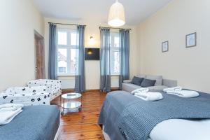 Posteľ alebo postele v izbe v ubytovaní Riviera Residence Apartments
