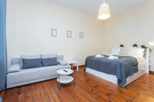 Posteľ alebo postele v izbe v ubytovaní Riviera Residence Apartments