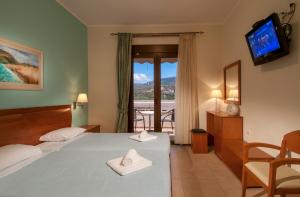 Postel nebo postele na pokoji v ubytování Kyniska Hotel + 36 fotografií
