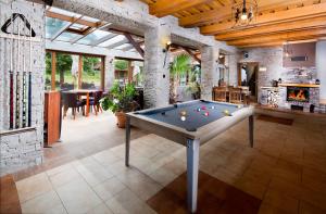 a large room with a pool table in it at Alzbeta resort - Aqua & Wellness in Liptovský Mikuláš