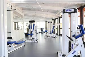 a gym with cardio machines and treadmills at Corallium Dunamar by Lopesan Hotels - Adults Only in Playa del Ingles