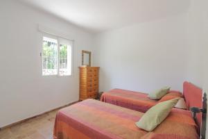 A bed or beds in a room at Villa Santa Lucia - 0204 Még 9 kép