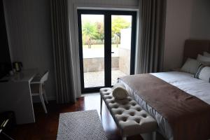Postel nebo postele na pokoji v ubytování Casa das Carpas