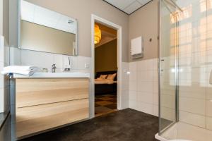 a bathroom with a sink and a shower at De Pastorie Bed & Breakfast in Roermond +119 photos