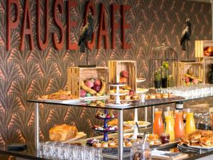 a buffet with many different types of food on display at Mercure Toulouse Centre Saint-Georges in Toulouse